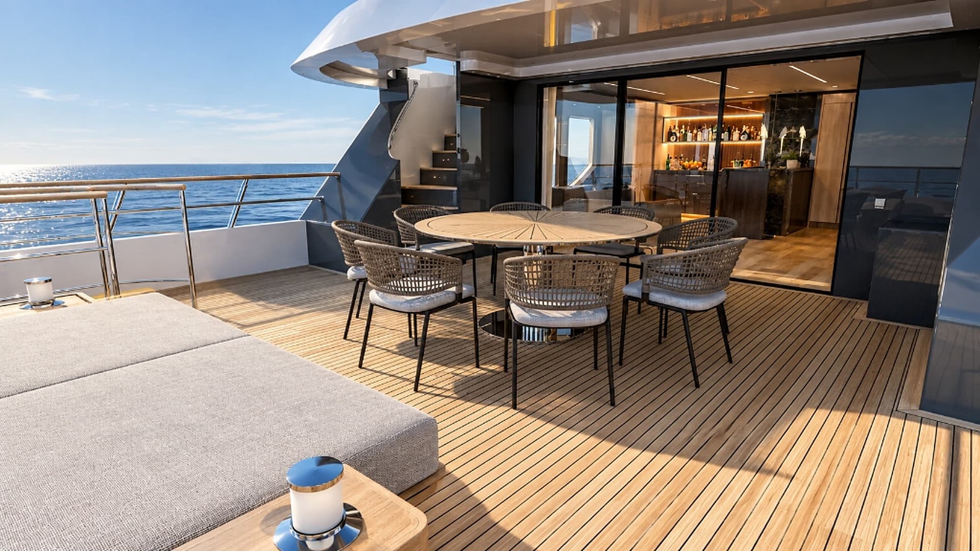 Bridge deck aft outdoor dining terrace and teak deck lounge